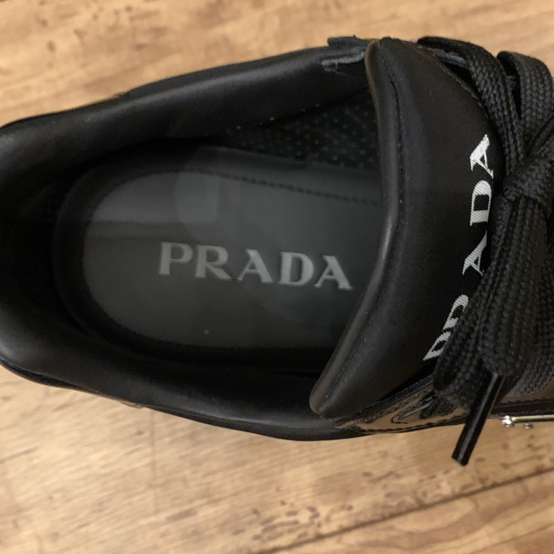 PRADA（プラダ） PRAX 01 Re-Nylon xブラッシュドレザー スニーカー